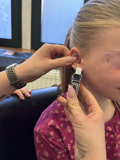 Ohrlochstechen Impression Kind